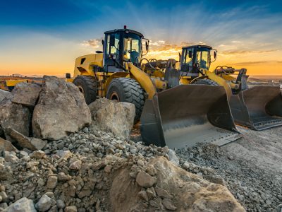 Two excavators removing stone in the construction works of a road